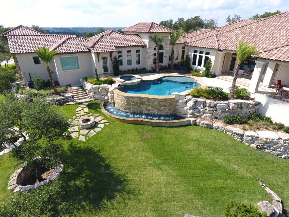 Custom Home in Bulverde Tropical Pool Other by Maldonado