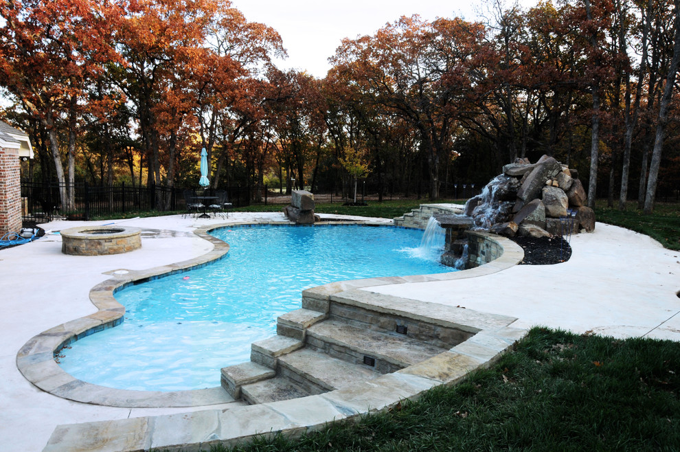 This is an example of a large world-inspired custom shaped natural swimming pool in Oklahoma City.
