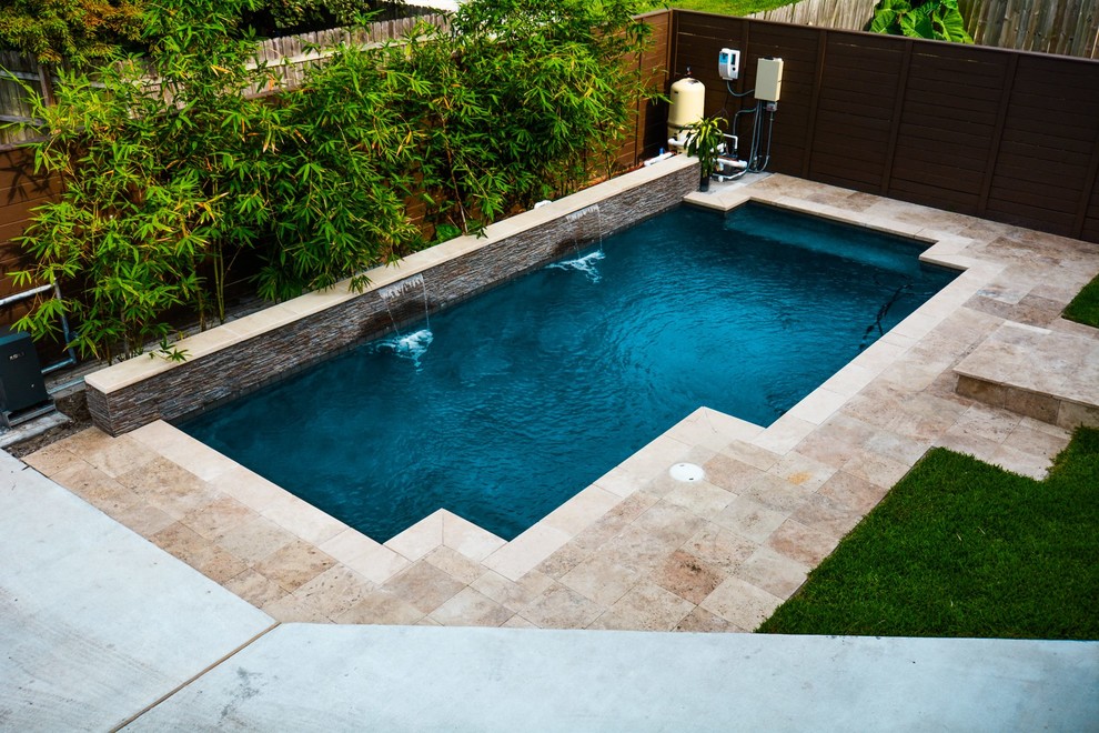 Pool - mid-sized contemporary backyard tile and rectangular pool idea in New Orleans