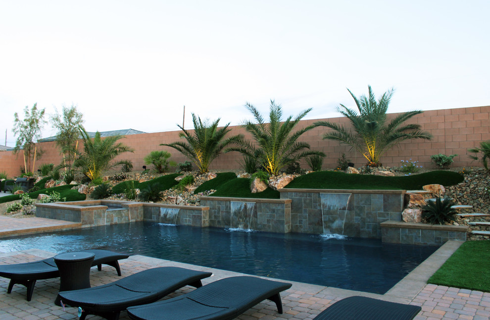 Example of a mid-sized minimalist custom-shaped pool design in Las Vegas