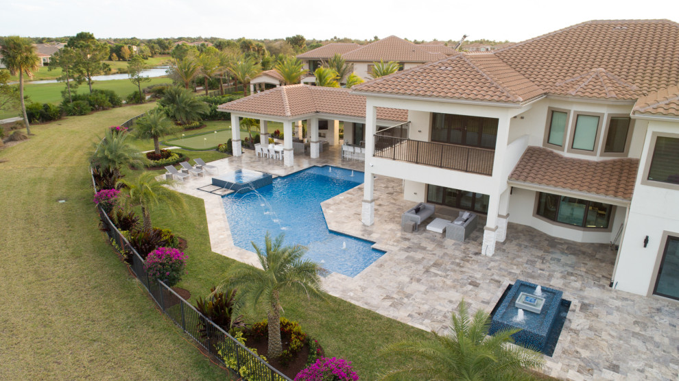 Custom Shaped Pool With Spa, Laminar Deck Jets and Custom Fountain in