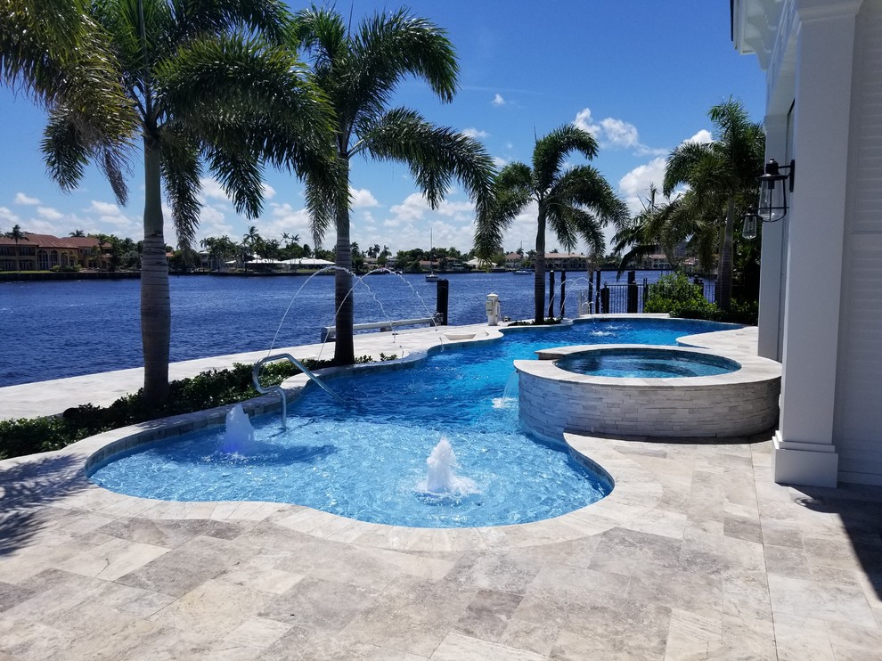 Custom Shaped Pool with Sun Shelf, Spa and Laminar Deck Jets in Pompano
