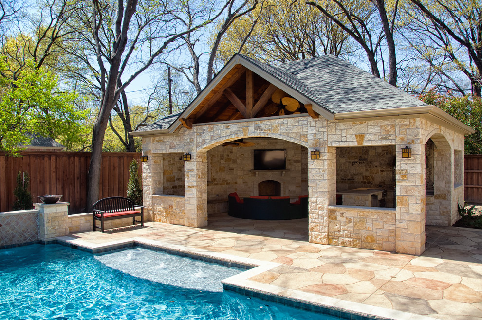 Mid-sized elegant backyard stone and rectangular lap pool house photo in Dallas