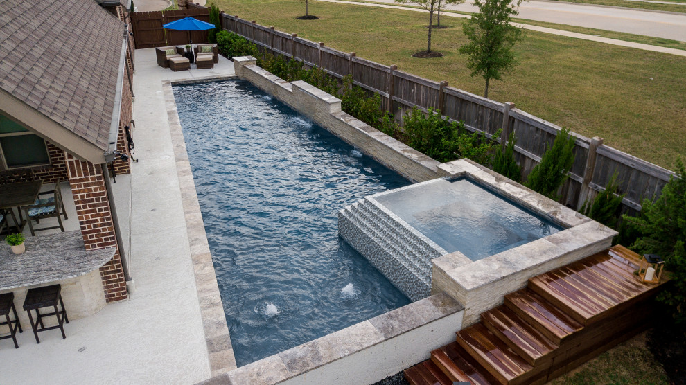 Inspiration for a large contemporary back custom shaped swimming pool in Houston with decking.