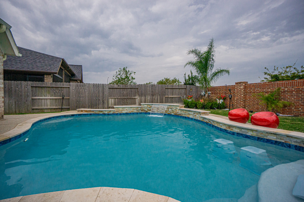 Design ideas for a medium sized world-inspired back custom shaped swimming pool in Houston.