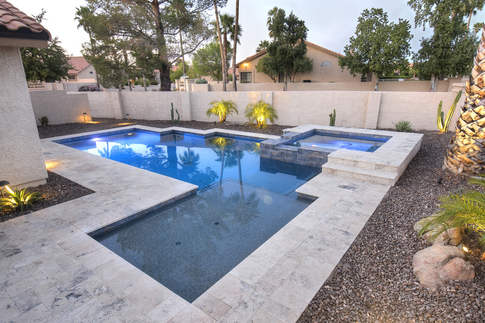 Idee per una piscina contemporanea a "L" di medie dimensioni e dietro casa con pavimentazioni in pietra naturale