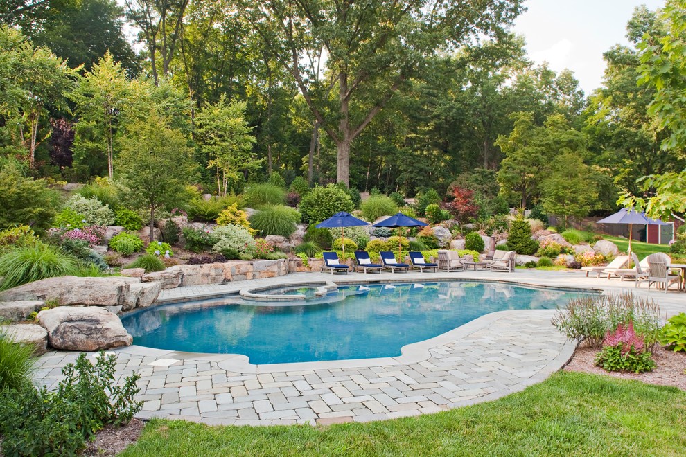 Photo of a classic custom shaped swimming pool in New York.