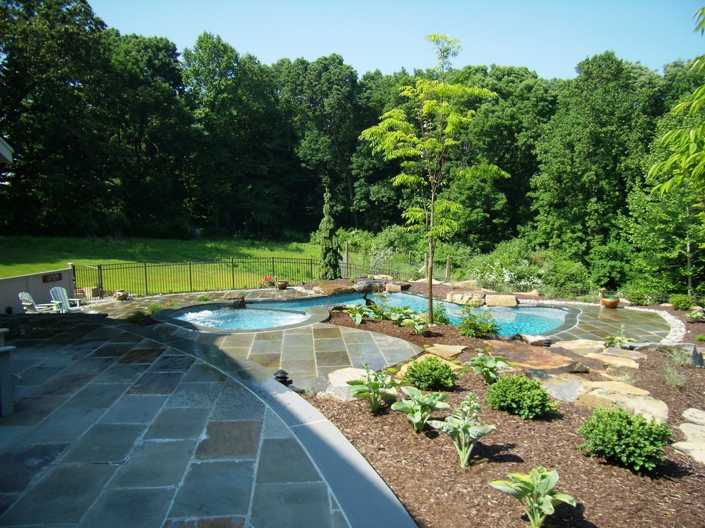 Delaware Township custom pool and raised spa with negative edge & water
