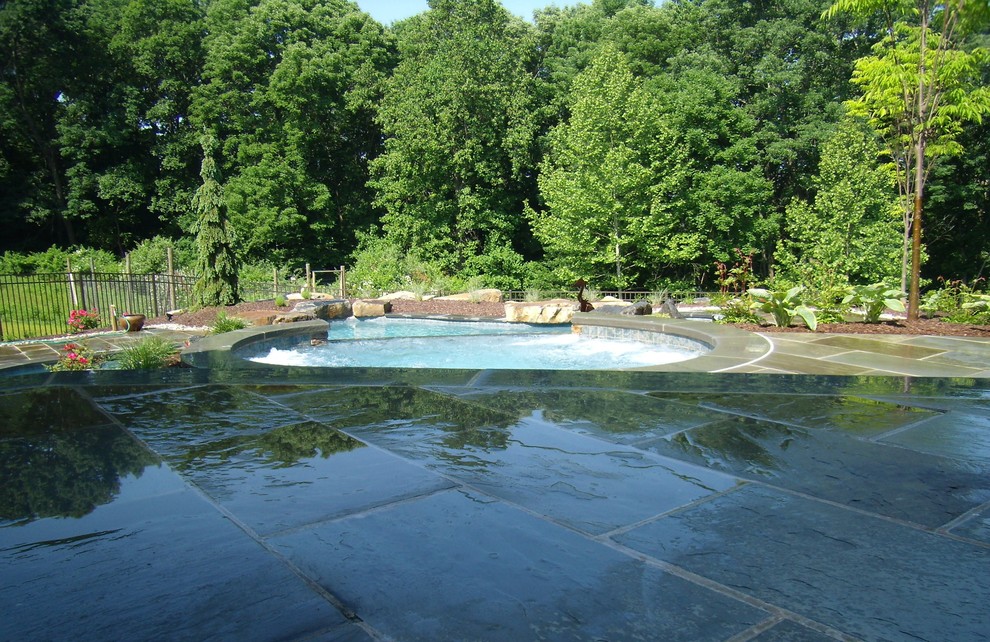 Delaware Township custom pool and raised spa with negative edge & water
