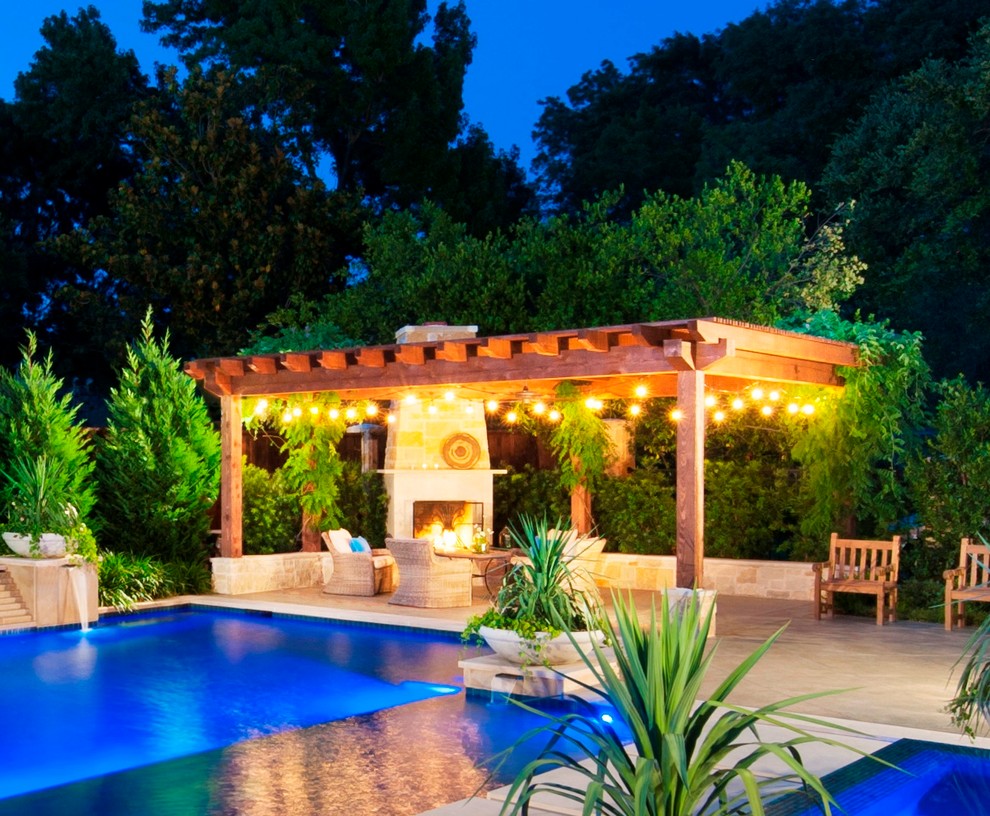 Large minimalist backyard stone and custom-shaped hot tub photo in Dallas