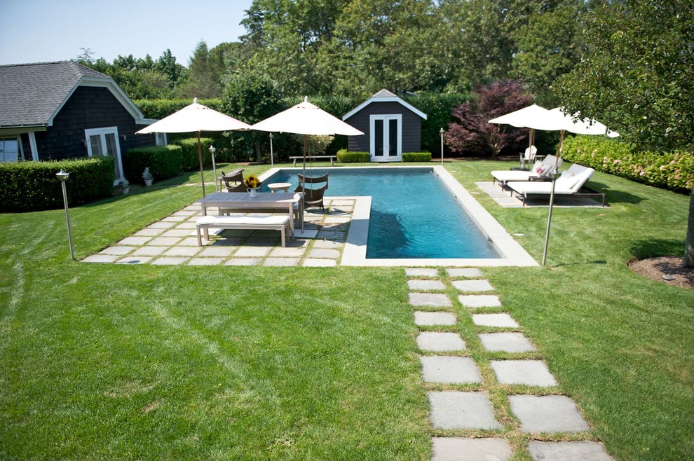 This is an example of a medium sized contemporary back l-shaped lengths swimming pool in Chicago.