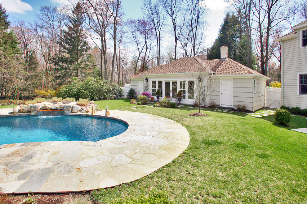Traditional custom shaped swimming pool in Denver.