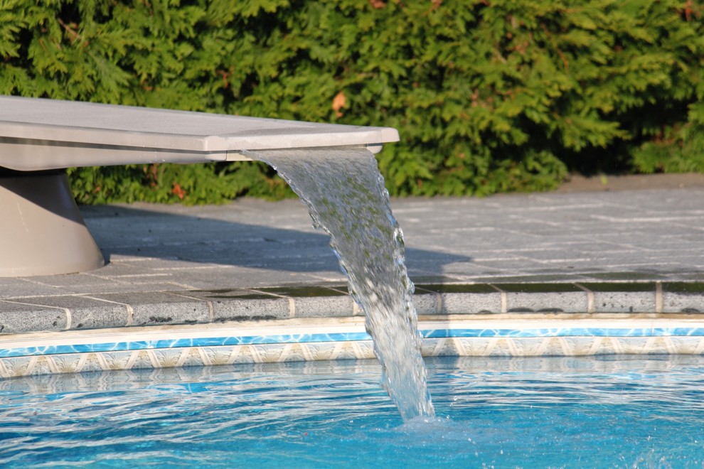 Diving Board Waterfall Traditional Pool New York by Grecian