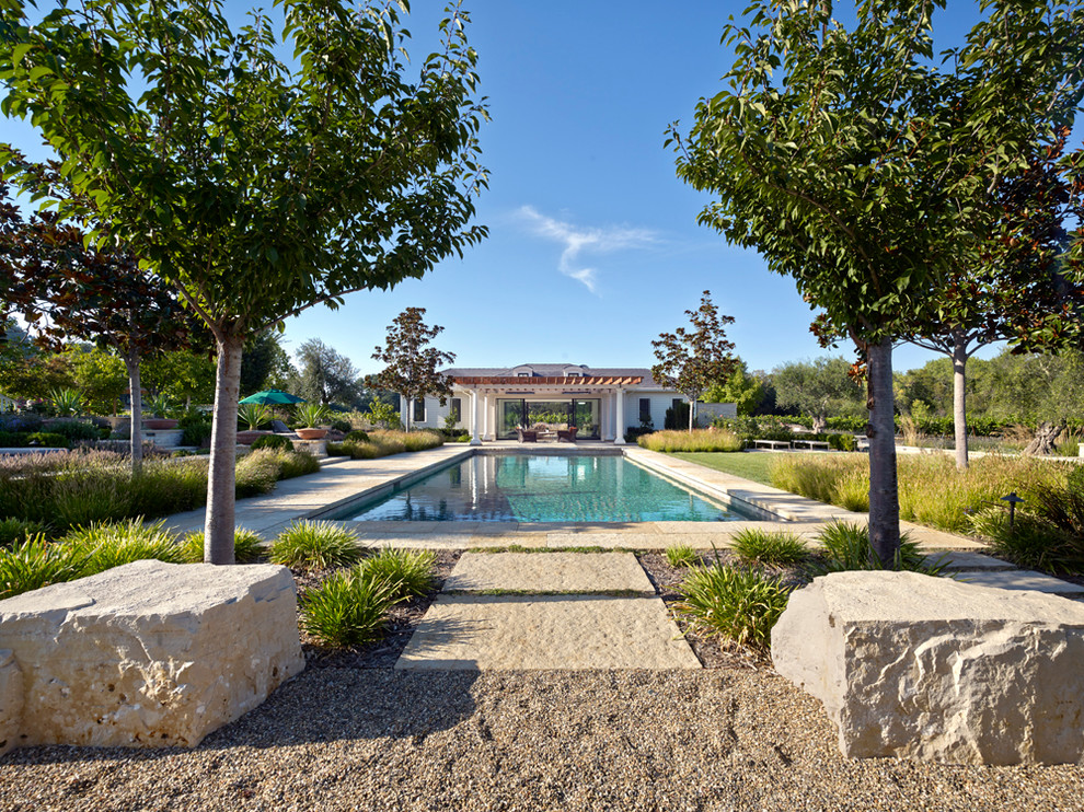This is an example of a farmhouse rectangular swimming pool in San Francisco with gravel.