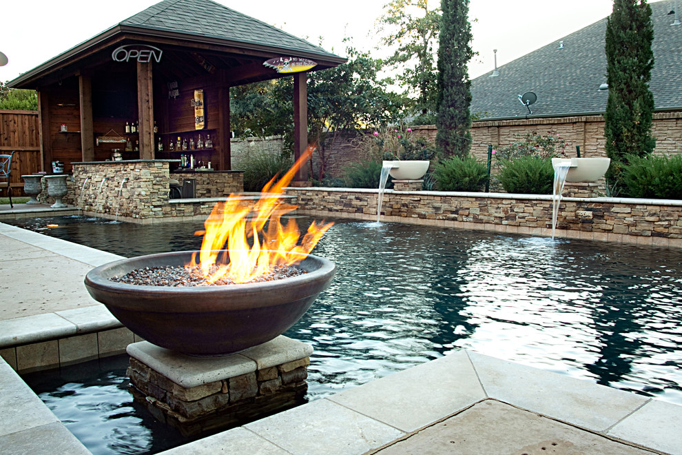 This is an example of a rustic swimming pool in Dallas.