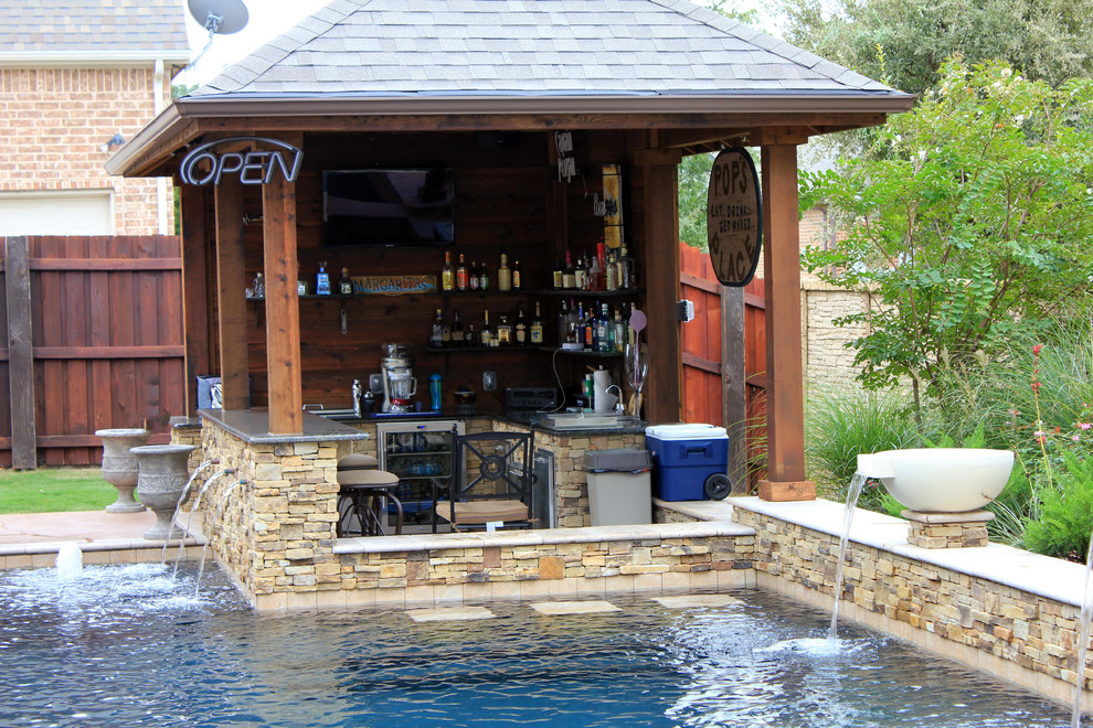 Inspiration for a classic swimming pool in Dallas with a bar area.