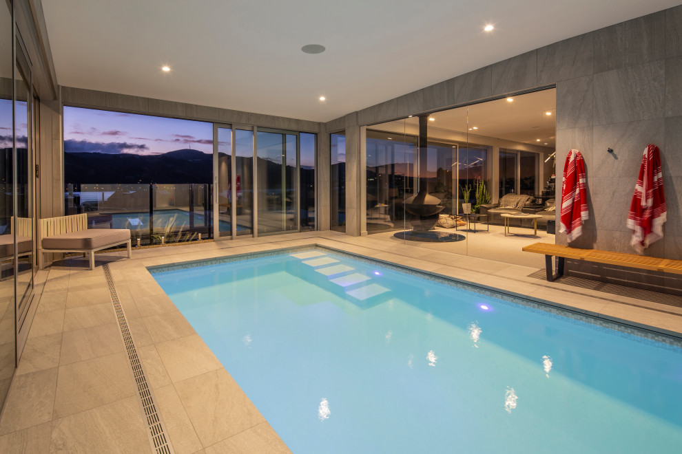 Pool - large modern indoor natural pool idea in Dunedin
