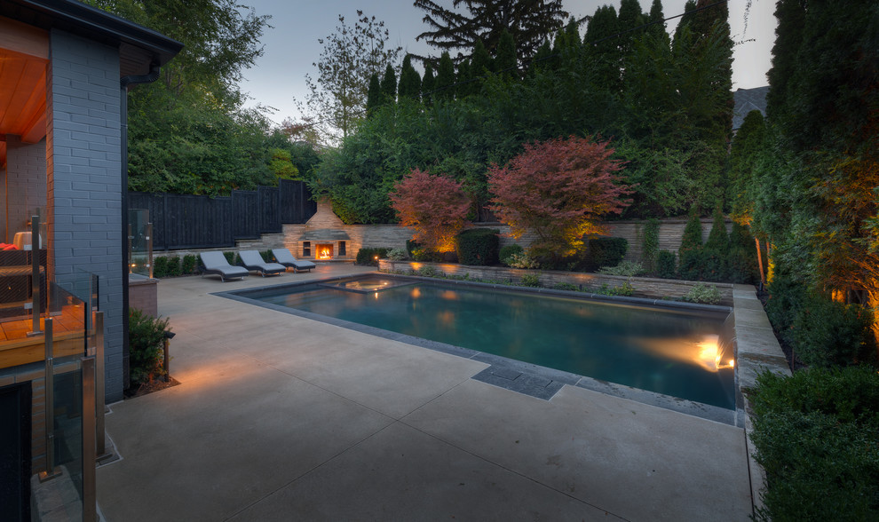 Large elegant backyard rectangular pool fountain photo in Other