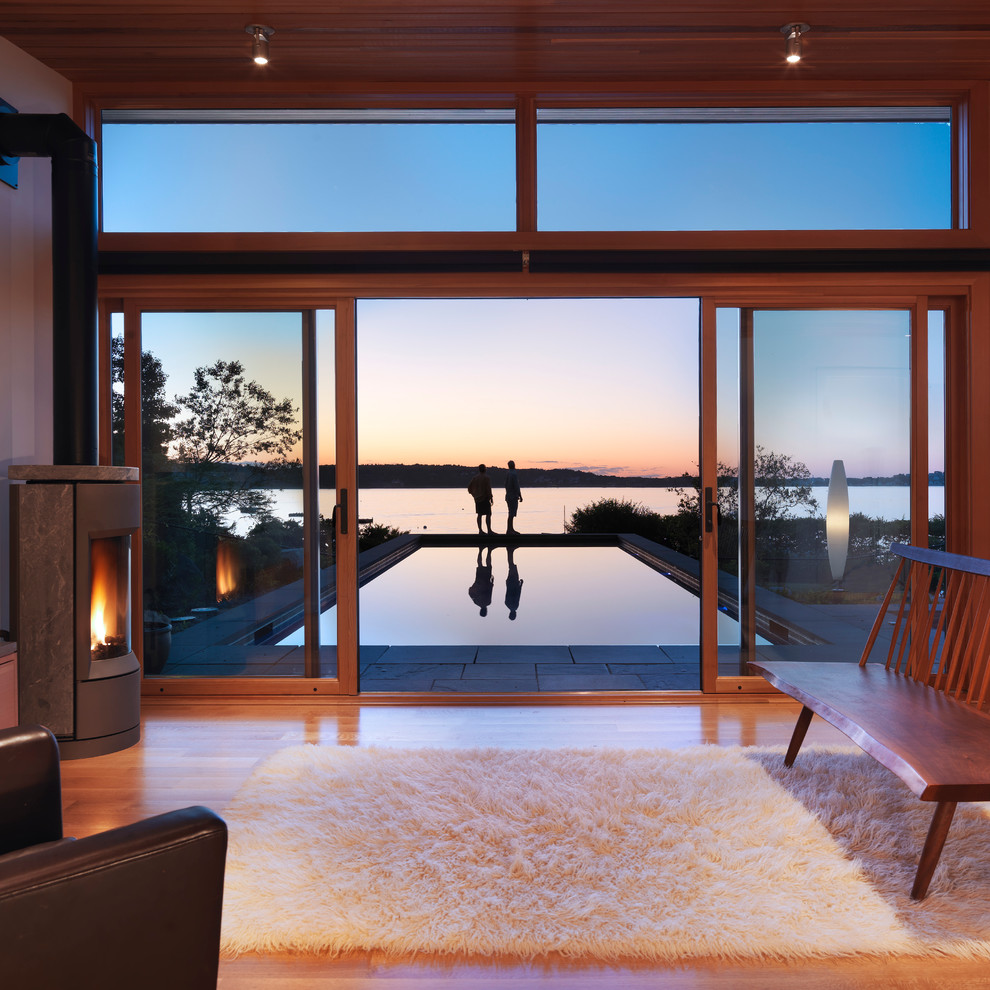 Small minimalist rectangular and stone pool photo in Boston
