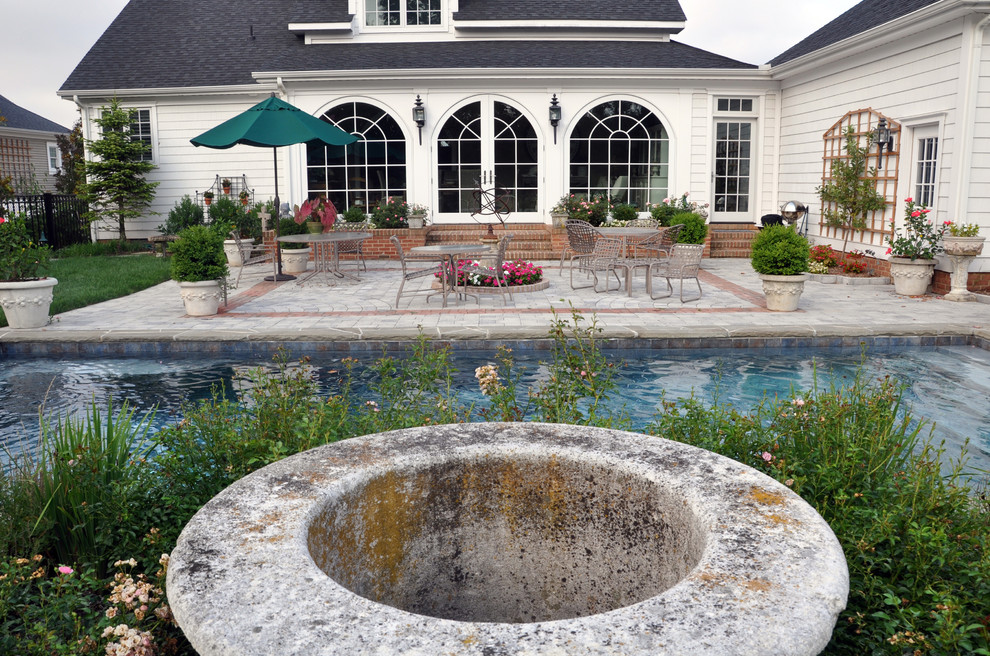 Huge eclectic courtyard concrete paver and rectangular lap pool fountain photo in DC Metro