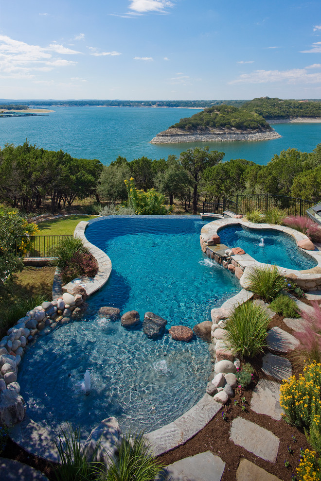 Inspiration for a timeless custom-shaped infinity hot tub remodel in Austin
