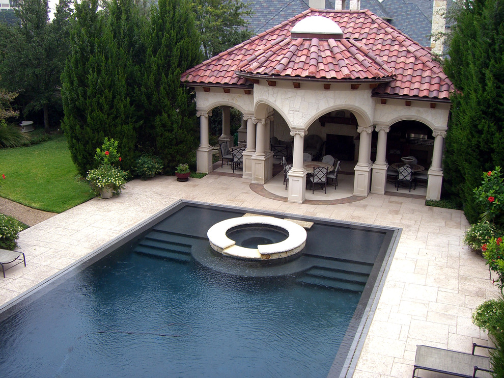 This is an example of a bohemian swimming pool in Dallas.