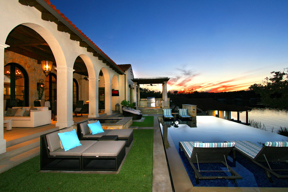 Inspiration for a mediterranean infinity swimming pool in Austin.