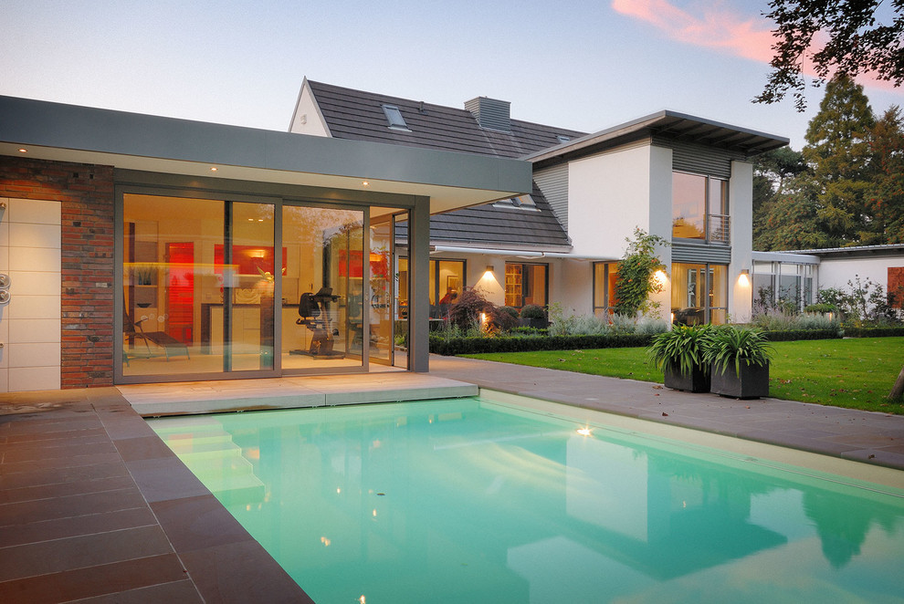 Medium sized contemporary back rectangular swimming pool in Cologne.