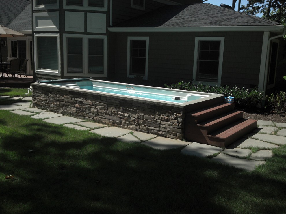This is an example of a modern swimming pool in Other.