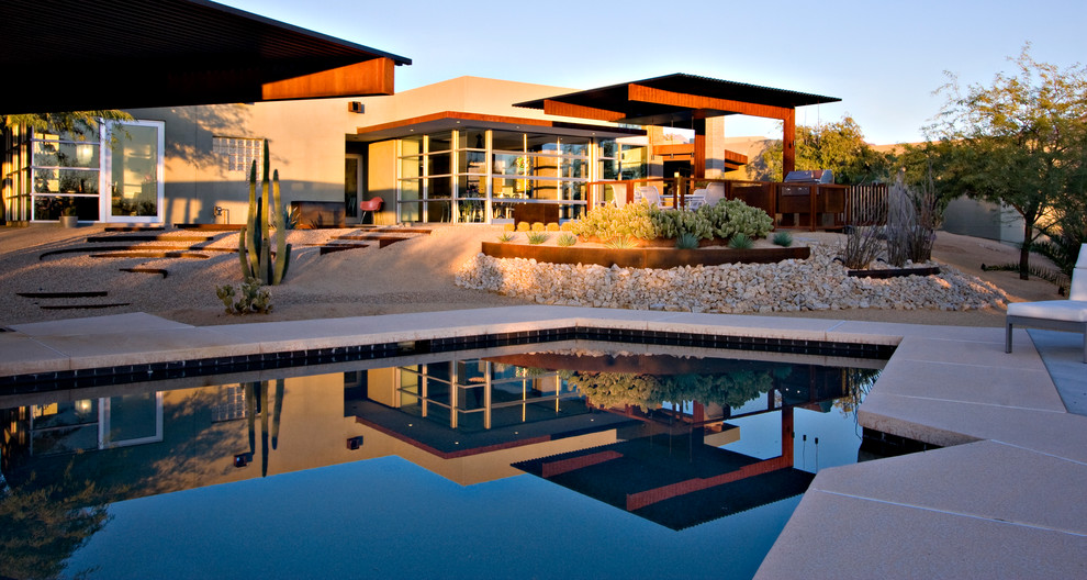 Inspiration for a contemporary custom shaped swimming pool in Phoenix.