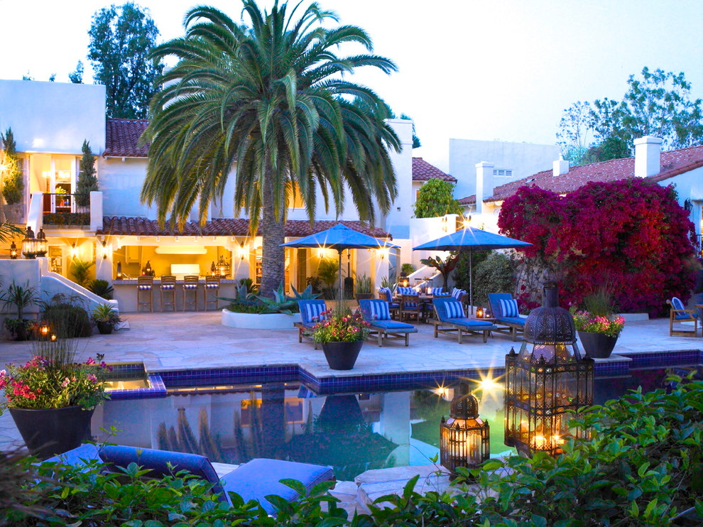 Inspiration for a mediterranean backyard rectangular lap hot tub remodel in Los Angeles