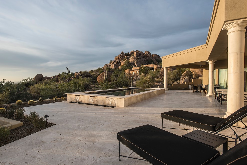 Pool - mid-sized transitional backyard stone and rectangular lap pool idea in Phoenix
