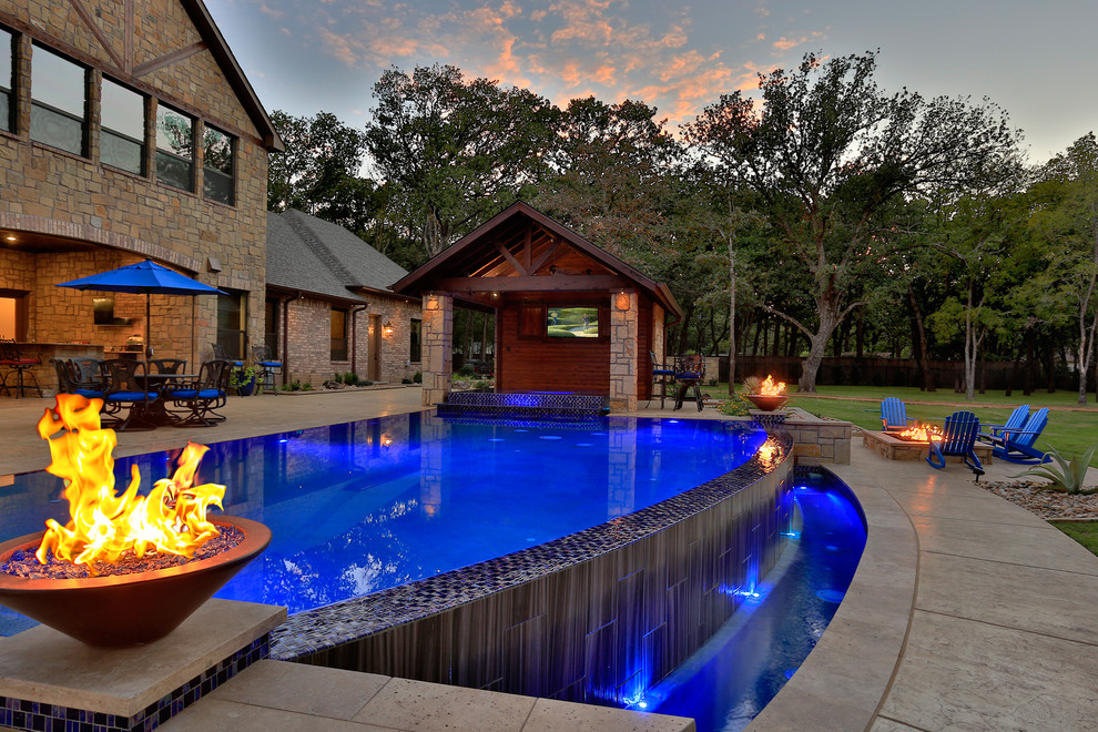 Trendy backyard custom-shaped infinity pool photo in Dallas