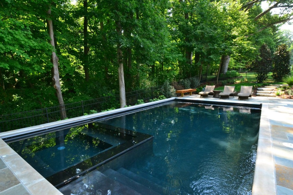 Example of a mid-sized classic backyard rectangular hot tub design in Cincinnati