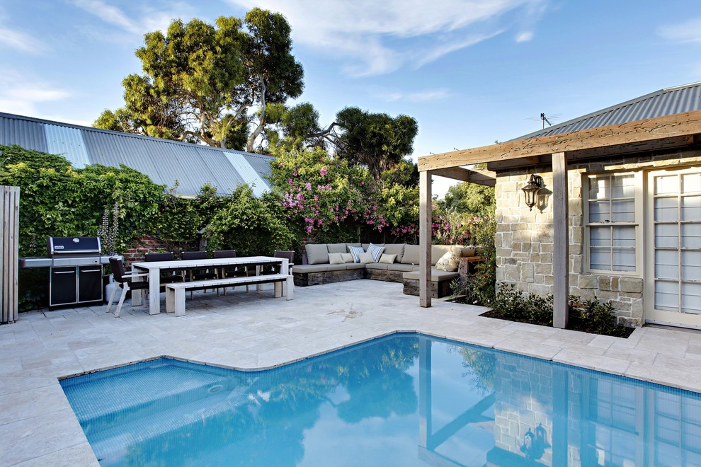 Inspiration for a small coastal backyard stone and custom-shaped natural hot tub remodel in Sydney