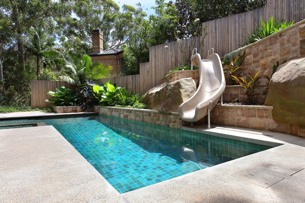 Mid-sized trendy side yard concrete and rectangular lap water slide photo in Sydney