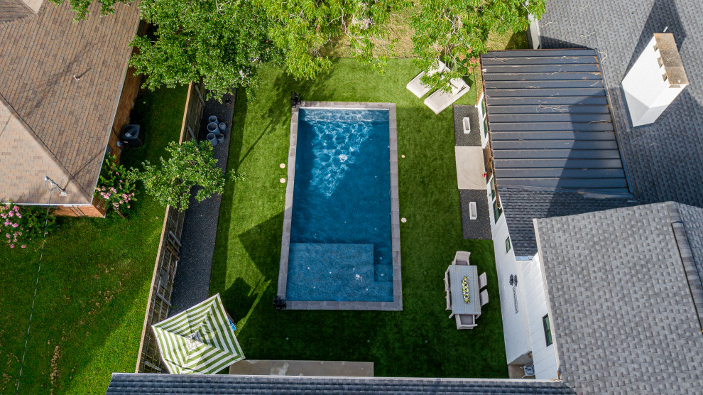 Inspiration for a medium sized country back rectangular swimming pool in Houston.