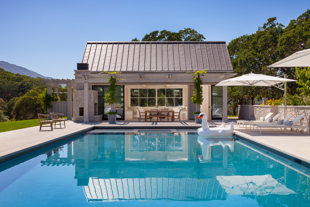 Rural rectangular swimming pool in San Francisco with a pool house.