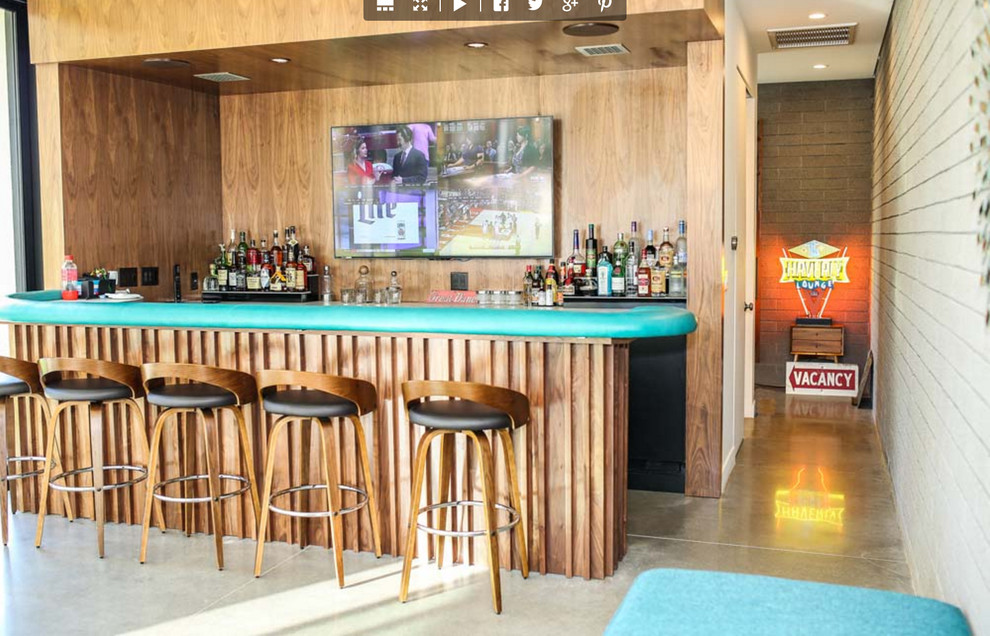 Foto di un grande angolo bar con lavandino con pavimento in cemento e pavimento grigio