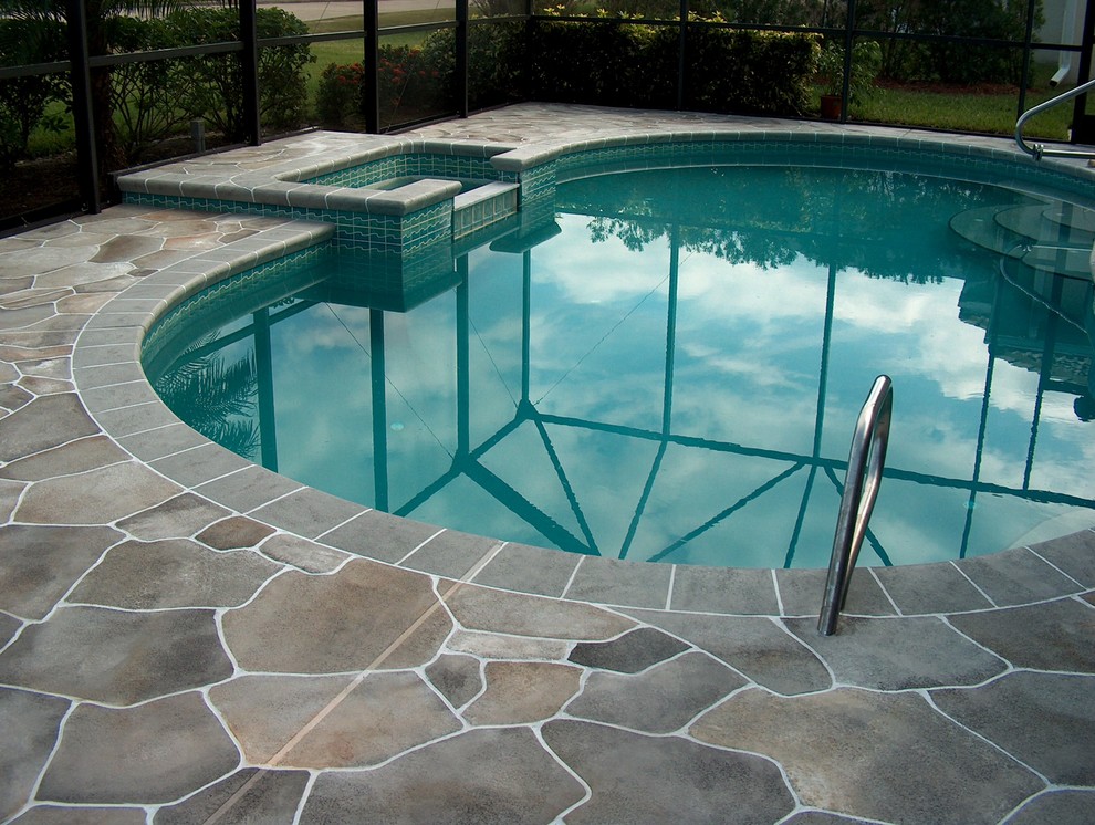 Flagstone pool deck Melbourne Traditional Pool Orlando by Concrete Designs of Florida