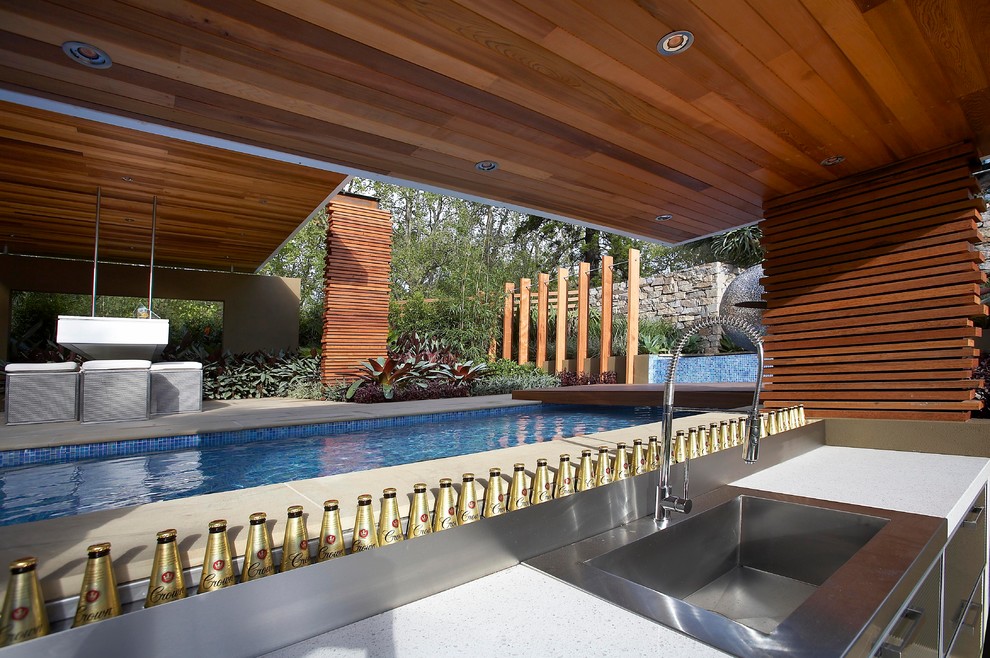 Trendy rectangular lap pool photo in Melbourne