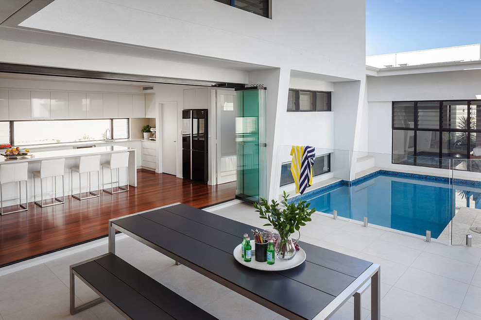 Photo of a contemporary back custom shaped swimming pool in Perth.