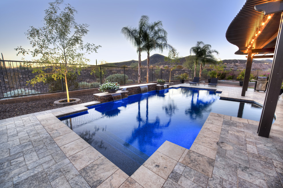 Inspiration for a mid-sized modern backyard stone and rectangular pool fountain remodel in Phoenix
