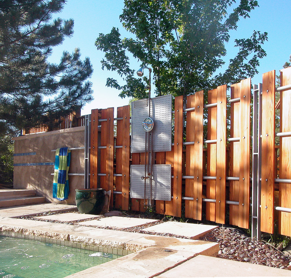 Inspiration for a contemporary backyard stone and rectangular hot tub remodel in Denver