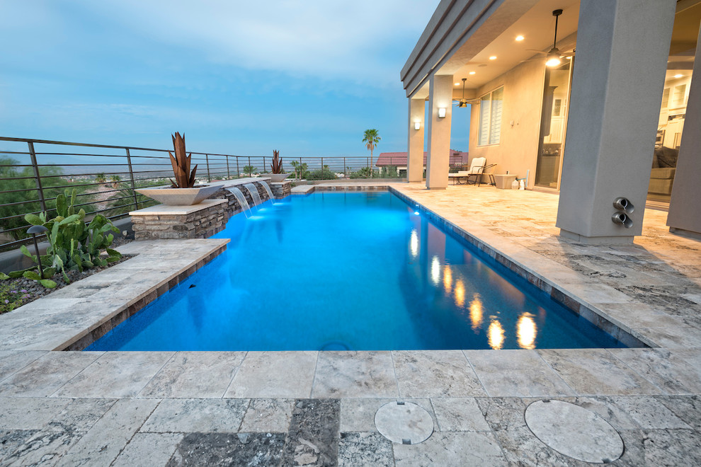 Mid-sized trendy courtyard stone and rectangular pool fountain photo in Phoenix