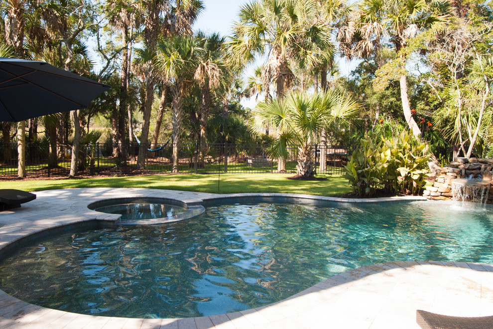 Mid-sized minimalist backyard stone and custom-shaped pool fountain photo in Charleston