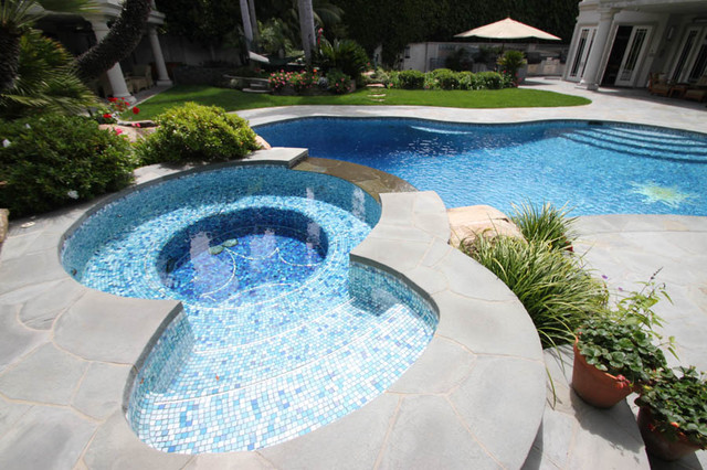 free-form-radius-bisazza-glass-mosaic-pool-and-natural-stone-overflow-spa-traditional