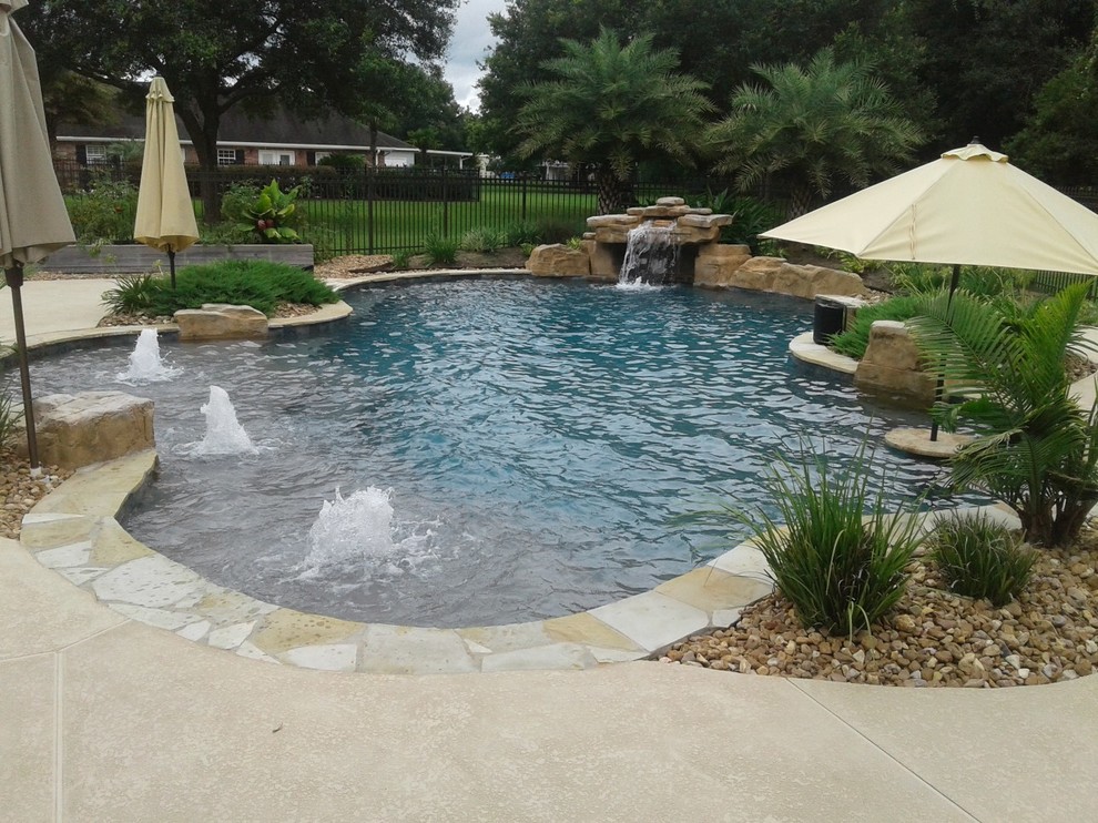 Freeform, natural pool with bubblers, tanning ledge, loveseat grotto ...