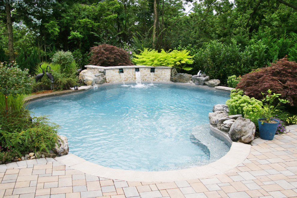 Traditional custom shaped swimming pool in New York.