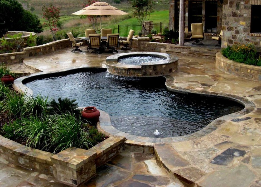 Freeforms with flagstone decking Tropical Pool Austin by Artisan Pool and Spa Houzz